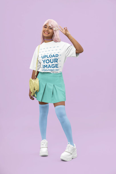 Oversized T-Shirt Mockup of a Woman in a Kawaii-Inspired Outfit Making a Peace Sign