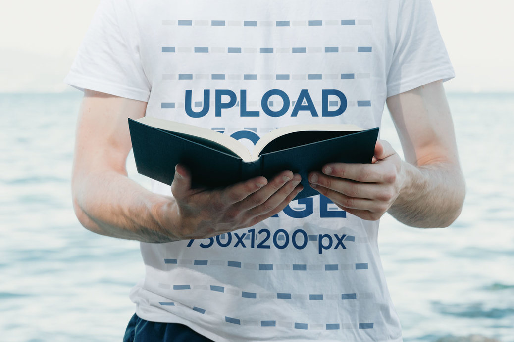 T-Shirt Mockup Featuring a Cropped-Face Man Reading a Christian Passage
