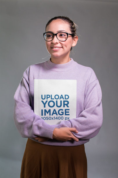 Geek Woman Holding a Book Mockup While Smiling
