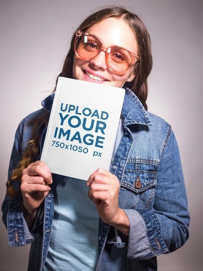 Vintage Shot of a Happy Woman Holding a Book Mockup
