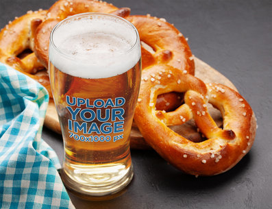 Mockup of a Glass Filled with Beer Placed Next to Fresh-Baked Pretzels m31554 r-el2