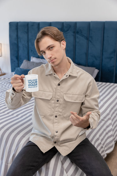 Mockup of a Serious Man Holding an 11 Oz Mug While Posing for a TikTok