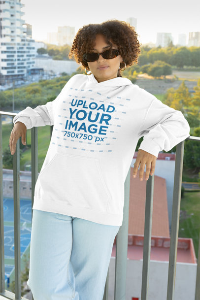 Pullover Hoodie Mockup of a Woman with Curly Hair Wearing Sunglasses