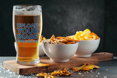 Mockup of a Beer Glass Standing in a Setting with Oktoberfest Snacks