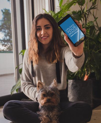 Woman Sitting with her Dog Holding an iPhone Mockup