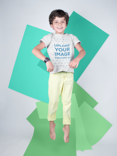 Kid Jumping Wearing a T-Shirt Mockup Against Colored Papers