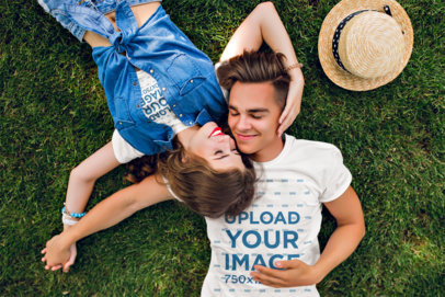 T-Shirt and Crop Top Mockup Featuring a Happy Couple Lying on the Grass m31610 r-el2