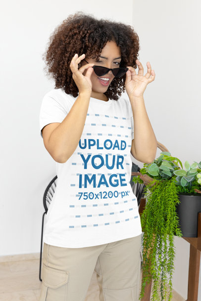 Bella Canvas T-Shirt Mockup of a Taking Off Her Sunglasses for a TikTok
