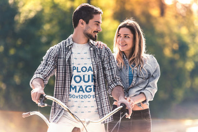 Heathered T-Shirt Mockup of a Happy Man Smiling to His Girlfriend While Riding a Bike