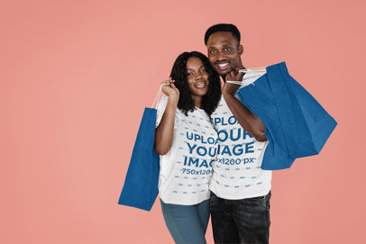 T-Shirt Mockup of a Happy Couple Carrying Shopping Bags m30010 r-el2