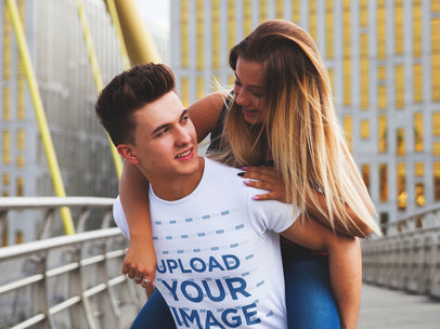 Round-Neck Tee Mockup Featuring a Happy Man Giving a Piggy Ride to His Girlfriend