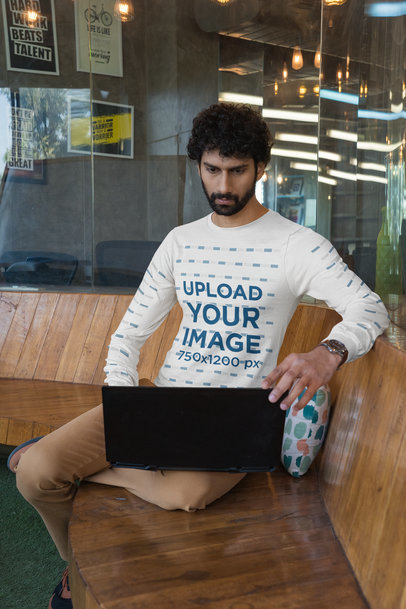 Bella Canvas Long-Sleeve Tee Mockup Featuring a Bearded Man Working