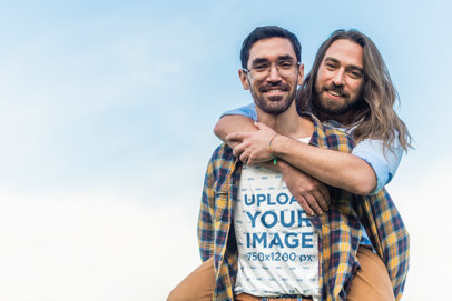 T-Shirt Mockup of a Man Giving a Piggy Ride to His Boyfriend