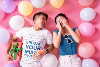 V-Neck Tee Mockup of a Man Lying Next to His Girlfriend in a Valentine's-Decorated Studio m31630 r-el2
