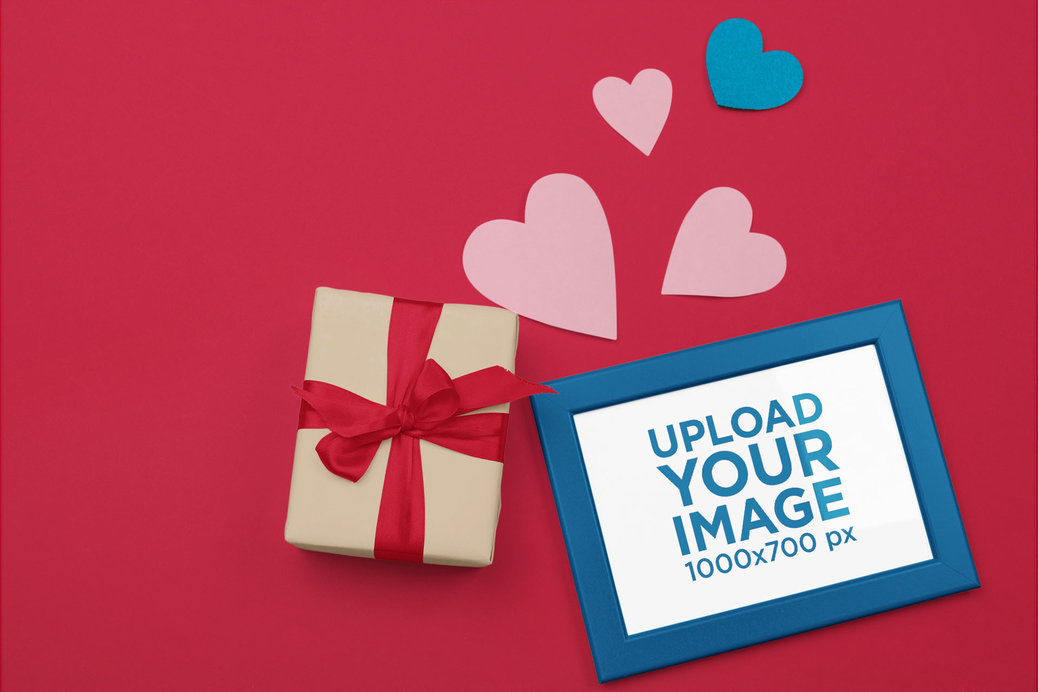 Art Print Mockup Featuring Paper Hearts and a Wrapped Gift for Valentine's Day