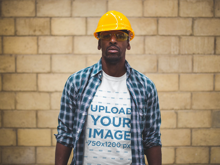 Serious Worker Wearing a T-Shirt Mockup and a Blue Plaid Shirt