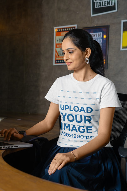 Gildan Tee Mockup of a Smiling Woman Working at an Office