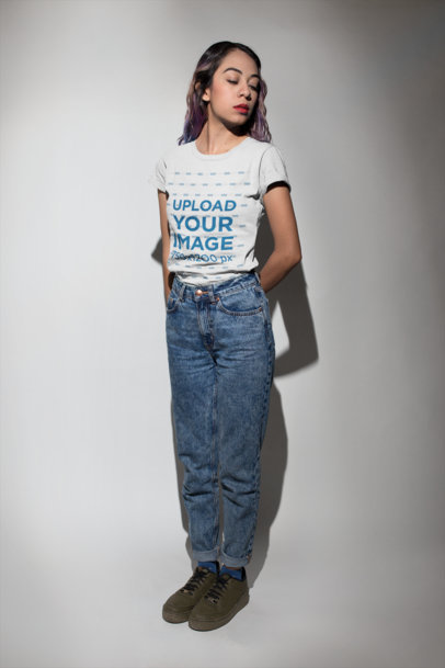 Hispanic Woman Standing in a Photo Studio Wearing a Tshirt Mockup