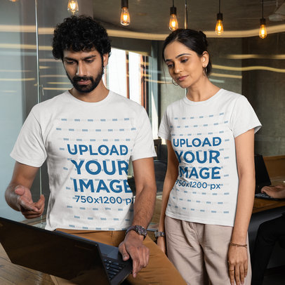 Round-Neck Gildan Tee Mockup Featuring a Man and a Woman at an Office
