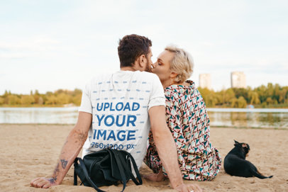 Back-View Tee Mockup of a Man Kissing His Girlfriend by the Lake