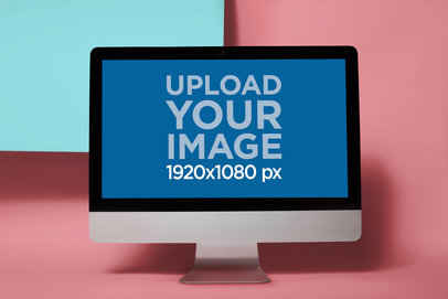 iMac Mockup Standing Against the Corner of a Colored Square a20676