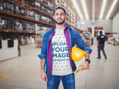 Happy Worker Wearing a T-Shirt Mockup at the Warehouse