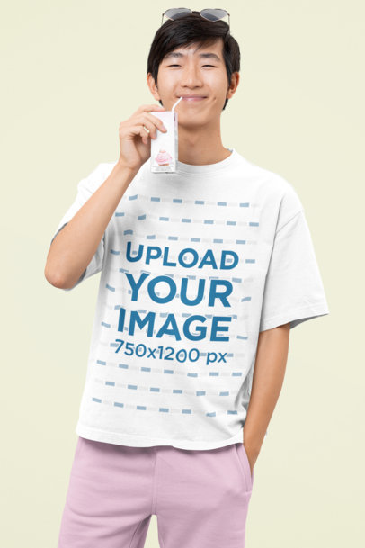 Oversized Tee Mockup Featuring a Kawaii Happy Man Drinking From a Juice Box m30687