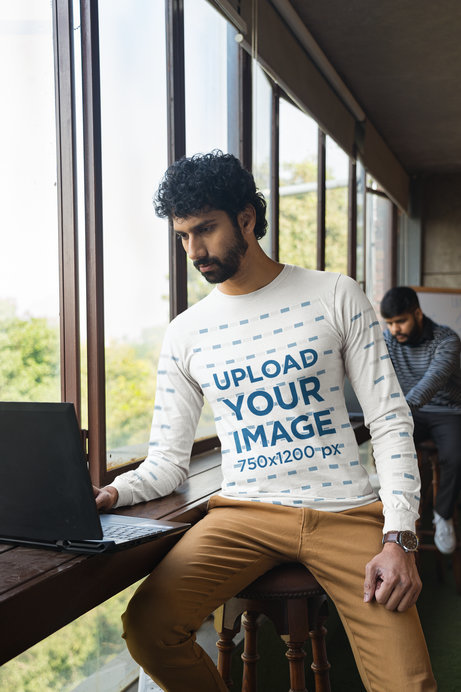Bella Canvas Long-Sleeve Tee Mockup Featuring a Man Working