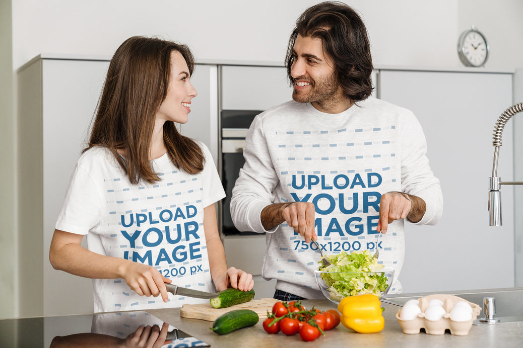 Heathered Sweatshirt and Round-Neck Tee Mockup of a Sweet Couple Cooking