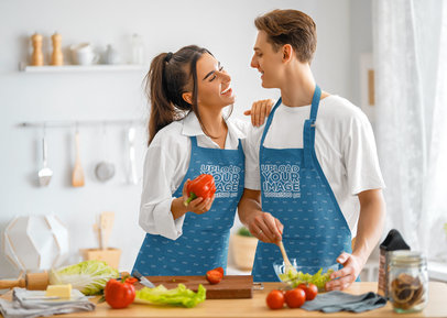 Apron Mockup Featuring a Happy Couple of Chefs Making a Salad
