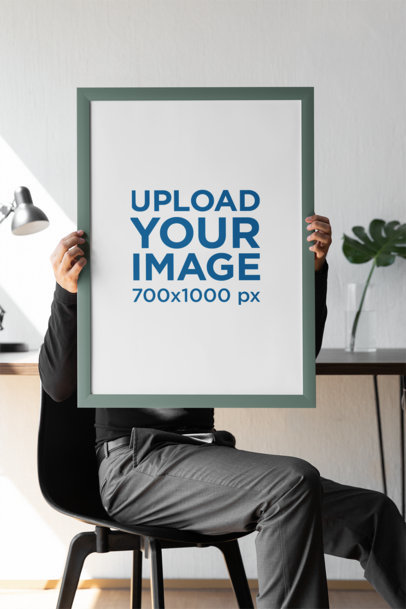 Mockup of a Person Holding an Art Print