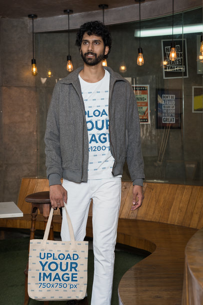 Gildan T-Shirt Mockup of a Bearded Man Carrying a Tote Bag