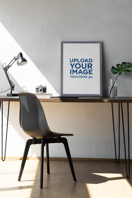 Mockup of an Art Print Placed on a Table Featuring a Plant and an Old Camera