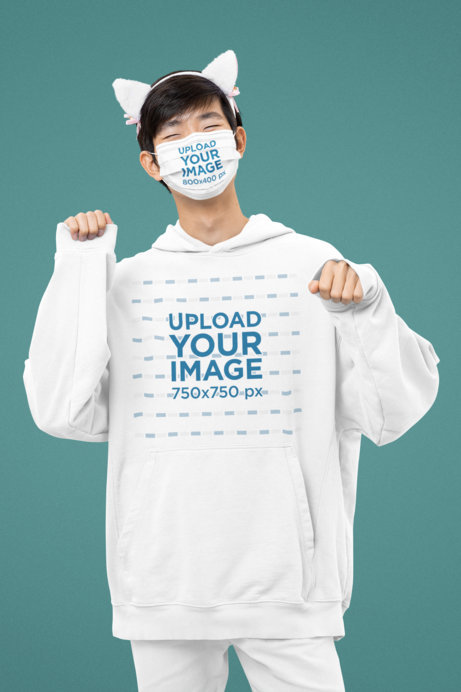 Face Mask Mockup of a Man in a Kawaii-Inspired Outfit Wearing an Oversized Hoodie