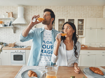 Round-Neck Tee Mockup of a Cute Couple Drinking an Orange Juice