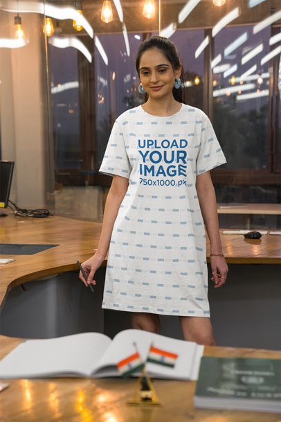 Sublimated T-Shirt Dress Mockup Featuring a Woman in an Office