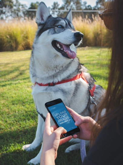 Woman Using a Space Gray iPhone Mockup with her Dog at the Park