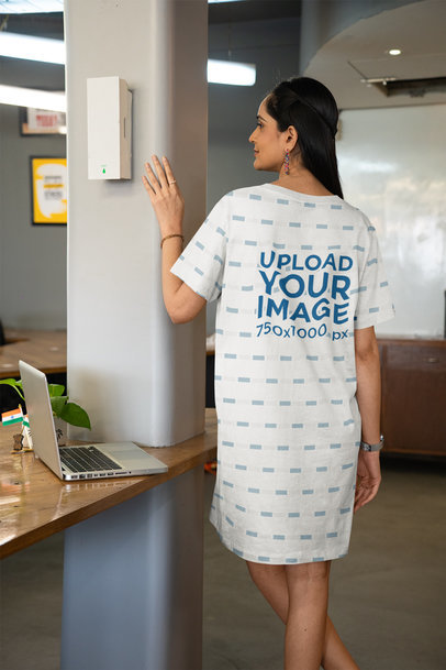 T-Shirt Dress Mockup of a Woman Walking in an Office