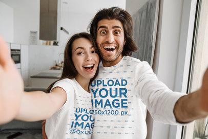 T-Shirt and Heathered Sweatshirt Mockup of a Cheerful Couple Taking a Selfie