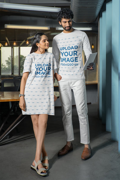 T-Shirt Dress and Long-Sleeve Tee Mockup Featuring a Man and Woman Walking Down the Hall