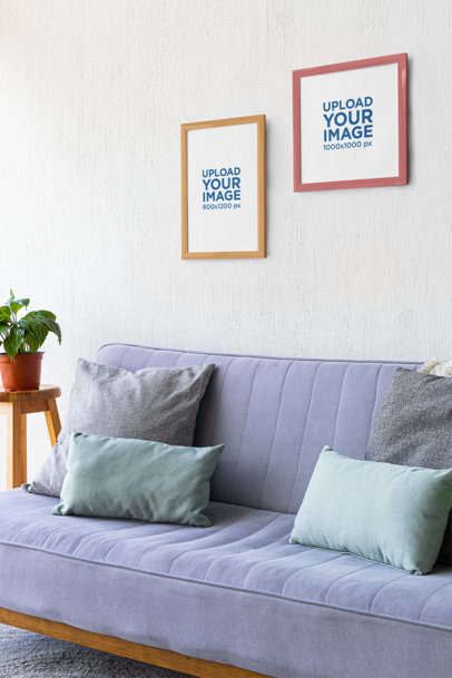 Mockup of Two Art Prints Hanging on a Wall Featuring a Nice Living Room