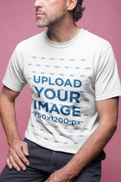 Closeup of a Man Wearing a Tshirt Mockup in a Pink Room