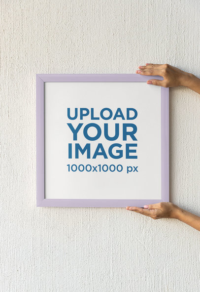 Mockup of a Woman Hanging a Squared-Sized Art Print m31581
