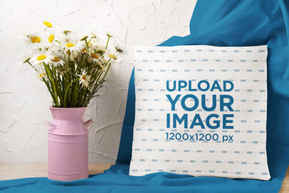 Square Pillow Mockup Featuring a Decorative Flower Vase