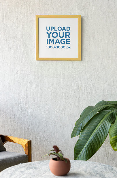 Mockup of a Squared Art Print Hanging on a Wall