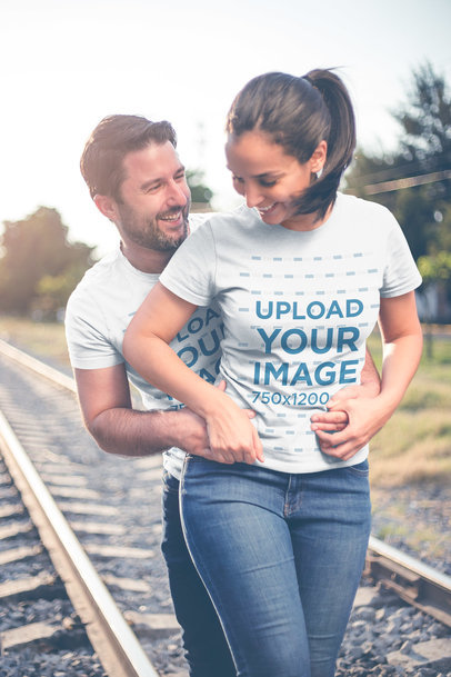Loving Man and Woman Wearing Tshirts Mockup by the Tracks