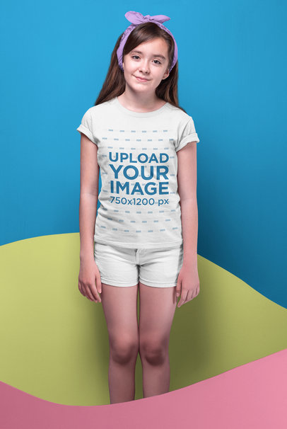 Kid Wearing a Tshirt Mockup and a Kerchief Between Cardboard Waves