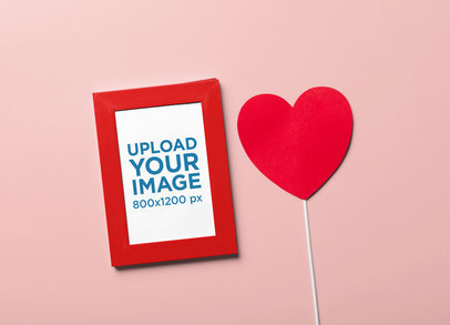 Valentine's Day-Themed Mockup of an Art Print Placed Next to a Heart-Shaped Paper m31821 r-el2