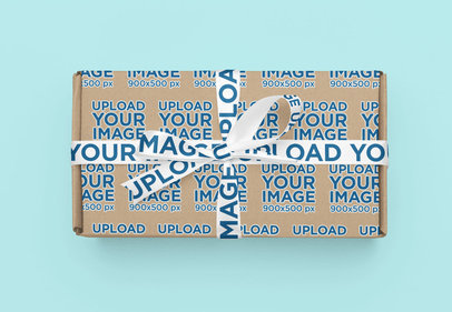 Mockup of a Box With a Ribbon Featuring a Colorful Surface