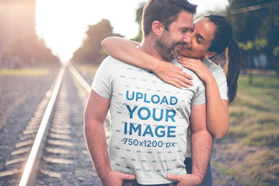 Man Wearing a Tshirt Mockup by the Rail Trail with his Wife